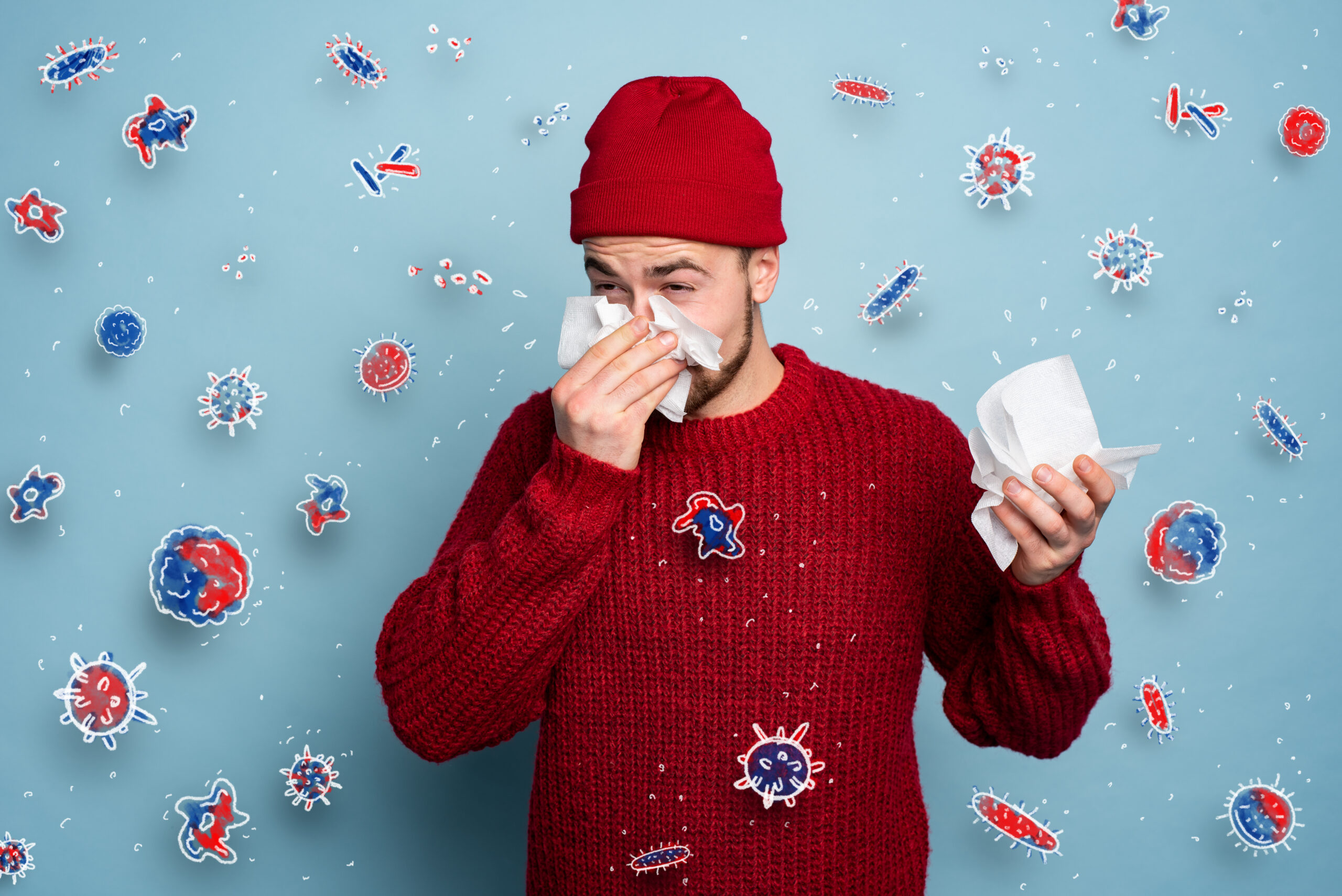 Person with allergy symptoms and thermometer