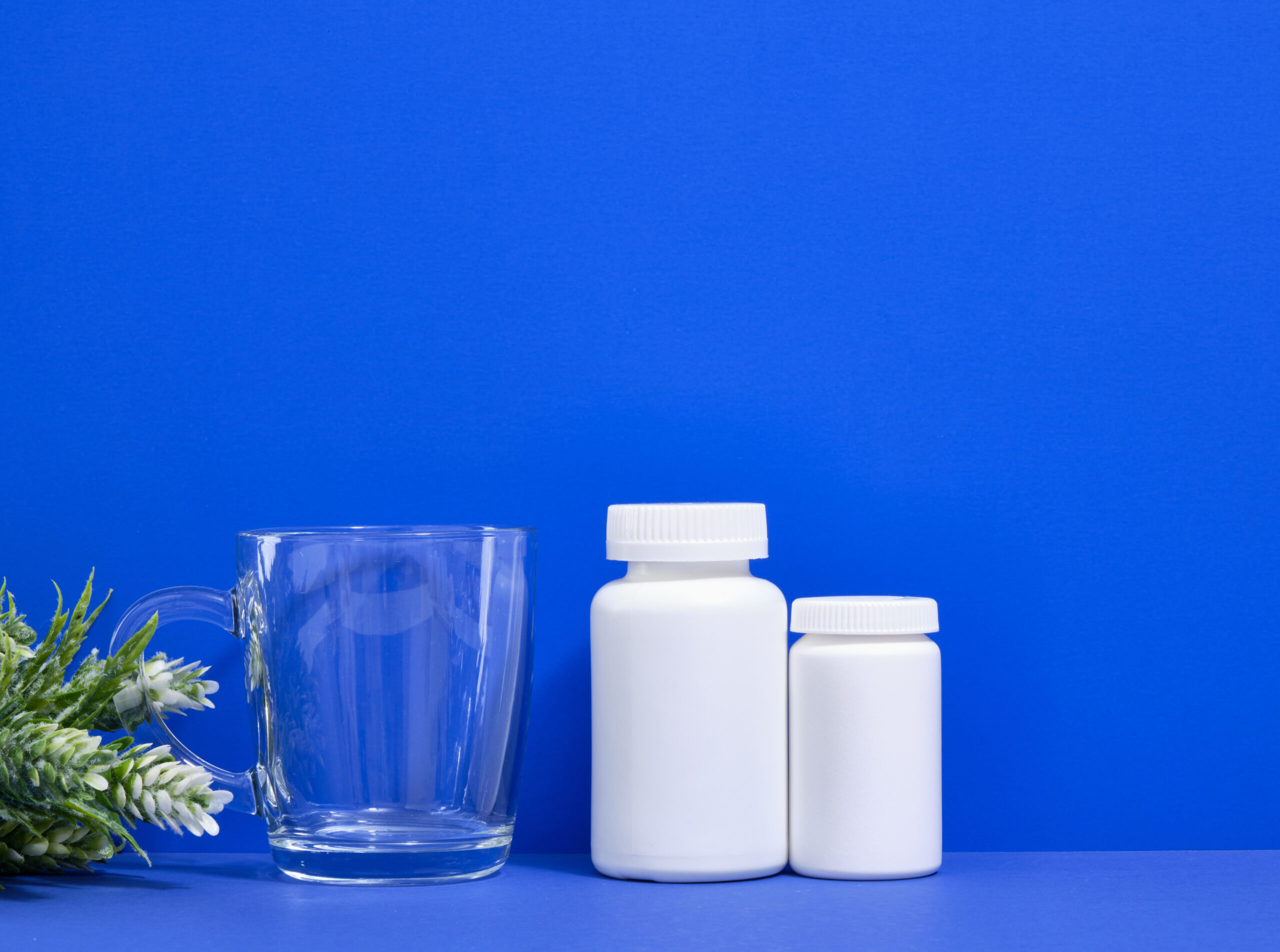 Bottles of magnesium and omega-3 supplements
